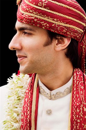 Close-up of a groom in a traditional wedding dress Stock Photo - Premium Royalty-Free, Code: 630-01192929