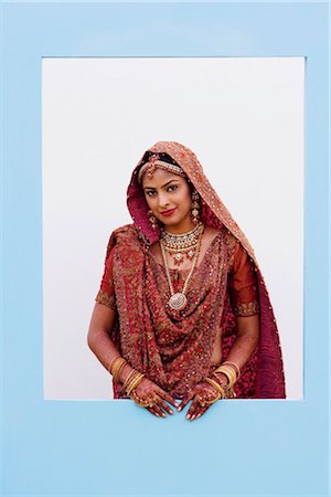 Portrait of a bride in a traditional wedding dress Stock Photo - Premium Royalty-Free, Code: 630-01192982