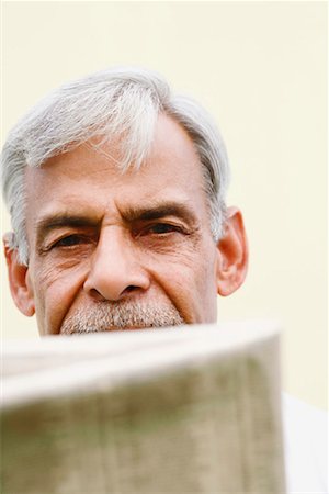 paper moustache - Portrait of a senior man with a newspaper Stock Photo - Premium Royalty-Free, Code: 630-01296908