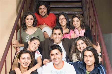 school girls arm around shoulder - Portrait of a group of college students sitting on a staircase Stock Photo - Premium Royalty-Free, Code: 630-01490431