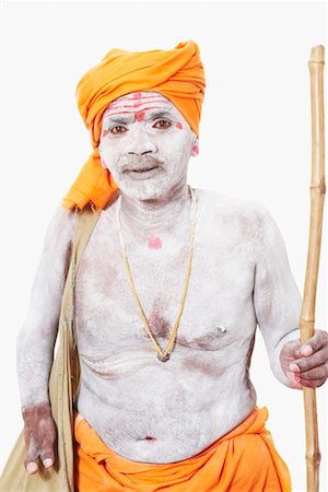 sadhu face photography - Portrait of a sadhu holding a cane Stock Photo - Premium Royalty-Free, Code: 630-01490613