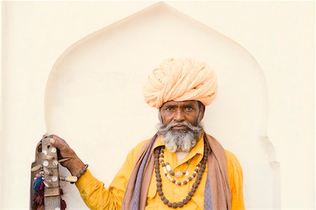 Portrait of a senior man holding a sitar Stock Photo - Premium Royalty-Free, Code: 630-01490706