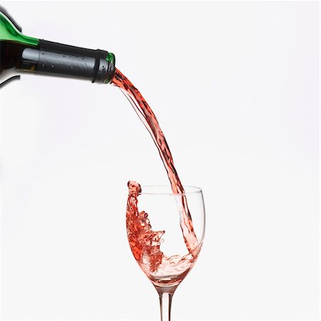 red wine pour - Red wine pouring from a bottle into a glass Stock Photo - Premium Royalty-Free, Code: 630-01490786