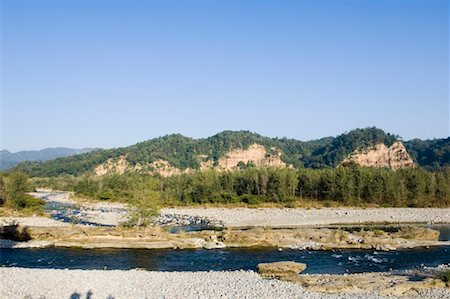 River in front of mountains, Jim Corbett National Park, Pauri Garhwal, Uttarakhand, India Foto de stock - Sin royalties Premium, Código: 630-01491130