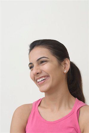 simsearch:630-01491603,k - Close-up of a young woman smiling Foto de stock - Sin royalties Premium, Código: 630-01491180