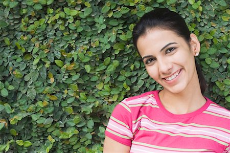 Portrait of a young woman smiling Stock Photo - Premium Royalty-Free, Code: 630-01491217