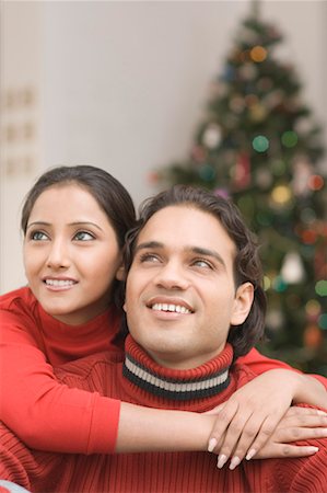 simsearch:630-01491245,k - Close-up of a young woman embracing a young man from behind Stock Photo - Premium Royalty-Free, Code: 630-01491258