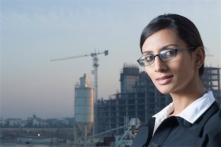 Portrait of a businesswoman wearing eyeglasses Stock Photo - Premium Royalty-Free, Code: 630-01491390