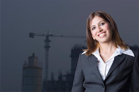 Portrait of a female architect smiling Stock Photo - Premium Royalty-Free, Code: 630-01491668