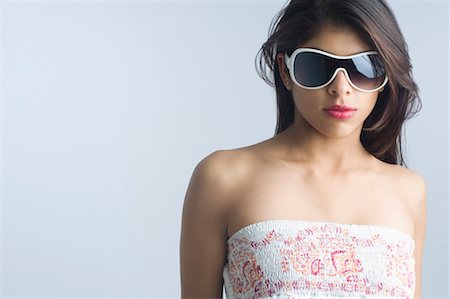 Close-up of a young woman wearing eyeglasses Stock Photo - Premium Royalty-Free, Code: 630-01491753