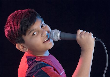 Portrait of a boy singing Stock Photo - Premium Royalty-Free, Code: 630-01491791