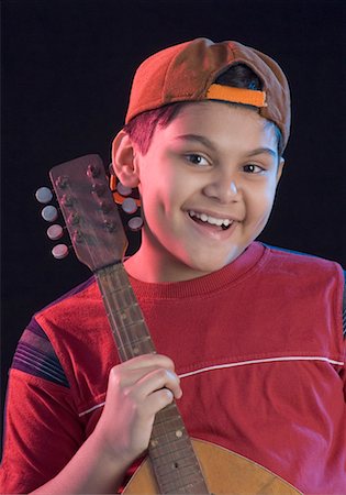 simsearch:630-01491707,k - Portrait of a boy holding a mandolin Stock Photo - Premium Royalty-Free, Code: 630-01491792