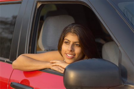 shining hair - Close-up of a young woman sitting in a car and thinking Stock Photo - Premium Royalty-Free, Code: 630-01491877