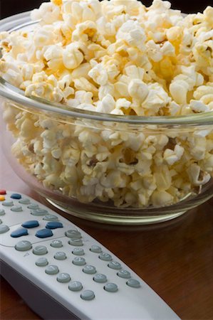 popcorn still life - Close-up of a remote control and popcorn in a bowl Stock Photo - Premium Royalty-Free, Code: 630-01491967