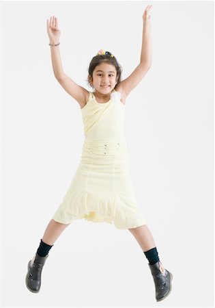 full photo in girls in studio - Portrait of a girl jumping Stock Photo - Premium Royalty-Free, Code: 630-01492095