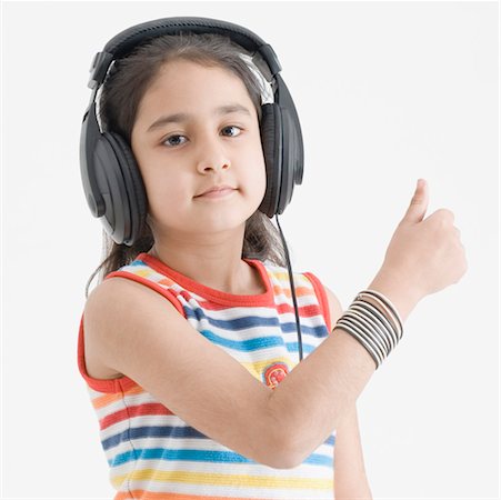 simsearch:630-01492101,k - Portrait of a girl wearing headphones and listening to music Stock Photo - Premium Royalty-Free, Code: 630-01492112