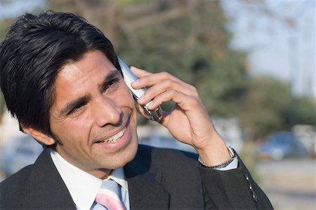 simsearch:630-01873878,k - Close-up of a businessman talking on a mobile phone Stock Photo - Premium Royalty-Free, Code: 630-01492553