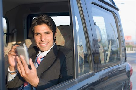 simsearch:630-01492537,k - Porträt eines Kaufmanns mit einer persönlicher Datenassistent in ein Auto Stockbilder - Premium RF Lizenzfrei, Bildnummer: 630-01492563