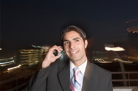 simsearch:630-01873329,k - Close-up of a businessman talking on a mobile phone Foto de stock - Sin royalties Premium, Código: 630-01492587