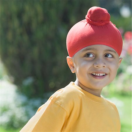 sikh boy alone images - Close-up of a boy smiling Stock Photo - Premium Royalty-Free, Code: 630-01492636