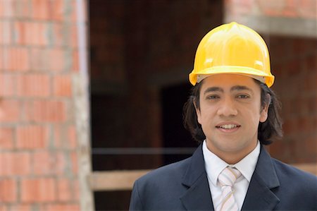 Portrait of a businessman wearing a hardhat Stock Photo - Premium Royalty-Free, Code: 630-01492689