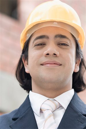 Portrait of a businessman wearing a hardhat Stock Photo - Premium Royalty-Free, Code: 630-01492691