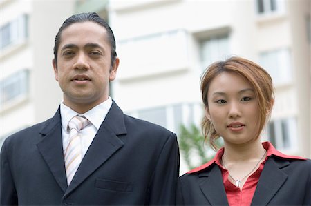 diversity indian workers - Portrait of a businessman and a businesswoman smiling Foto de stock - Sin royalties Premium, Código: 630-01492731