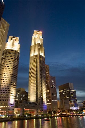 Buildings lit up at night, Singapore Stock Photo - Premium Royalty-Free, Code: 630-01492796