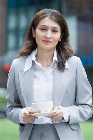 fiore - Portrait of a businesswoman holding a cup of tea Stock Photo - Premium Royalty-Free, Code: 630-01492810