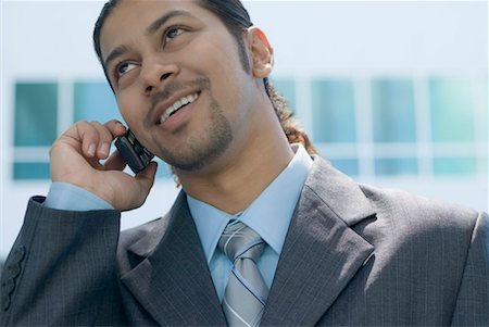 simsearch:630-01873329,k - Close-up of a businessman talking on a mobile phone Foto de stock - Sin royalties Premium, Código: 630-01492873