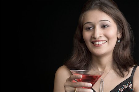 simsearch:630-01492926,k - Close-up of a young woman holding a martini Stock Photo - Premium Royalty-Free, Code: 630-01492946