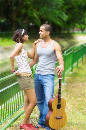 shaving man woman - Mid adult woman and a young man looking at each other and smiling Stock Photo - Premium Royalty-Free, Code: 630-01493030