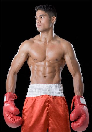 Close-up of a boxer wearing boxing gloves Stock Photo - Premium Royalty-Free, Code: 630-01493092