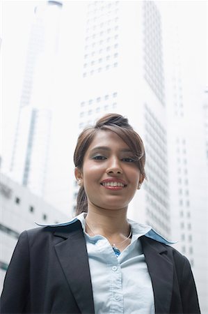Portrait of a businesswoman smiling, Singapore Stock Photo - Premium Royalty-Free, Code: 630-01707763