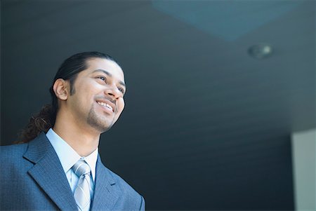 simsearch:630-01492837,k - Low angle view of a businessman smiling at an airport Stock Photo - Premium Royalty-Free, Code: 630-01707921