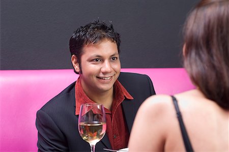 Young couple sitting in a restaurant Stock Photo - Premium Royalty-Free, Code: 630-01707953