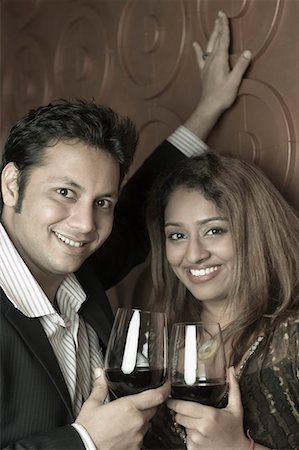 simsearch:630-01492926,k - Portrait of a young couple holding glasses of wine Stock Photo - Premium Royalty-Free, Code: 630-01708000