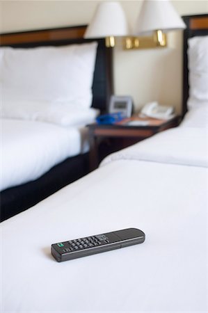 simsearch:630-01708436,k - Remote control on the bed in a hotel room Fotografie stock - Premium Royalty-Free, Codice: 630-01708429