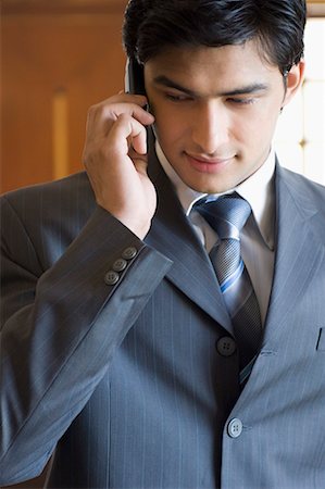 simsearch:630-01873878,k - Close-up of a businessman talking on a mobile phone Stock Photo - Premium Royalty-Free, Code: 630-01708457