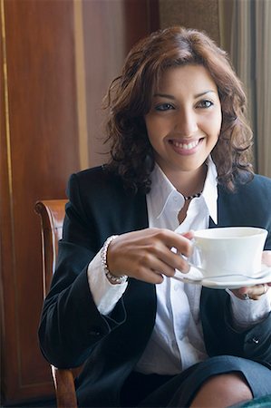 Close-up of a businesswoman holding a cup of tea Stock Photo - Premium Royalty-Free, Code: 630-01708471