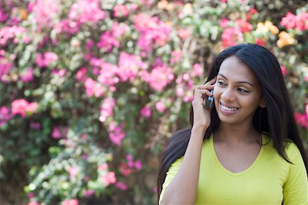 Young woman talking on a mobile phone Stock Photo - Premium Royalty-Free, Code: 630-01708607