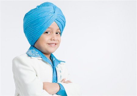 sikh boy alone images - Portrait of a boy smiling Stock Photo - Premium Royalty-Free, Code: 630-01708775