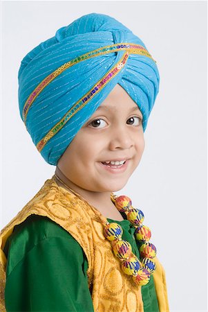 sikh boy alone images - Portrait of a boy smiling Stock Photo - Premium Royalty-Free, Code: 630-01708782