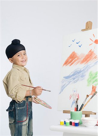 sikh boy patka - Portrait of a boy holding a palette and a paintbrush Stock Photo - Premium Royalty-Free, Code: 630-01708792
