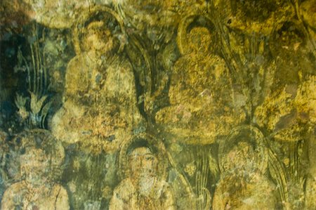 picture carved on stone wall close up - Mural of Buddha on the wall of a cave, Ajanta, Maharashtra, India Stock Photo - Premium Royalty-Free, Code: 630-01708824