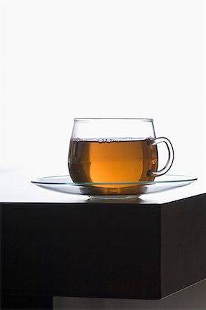 Close-up of a cup of herbal tea on a saucer Stock Photo - Premium Royalty-Free, Code: 630-01709167