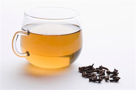 Close-up of a cup of herbal tea with cloves Stock Photo - Premium Royalty-Free, Code: 630-01709171