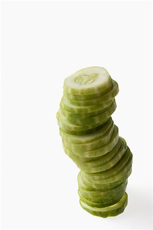 sliced cucumber - Close-up of a stack of cucumber slices Stock Photo - Premium Royalty-Free, Code: 630-01709254