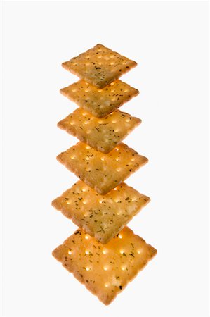 snack cracker white background - Close-up of biscuits in a row Stock Photo - Premium Royalty-Free, Code: 630-01709419