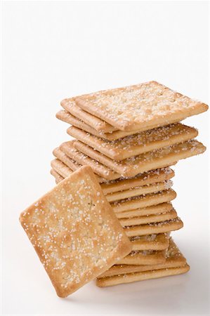 snack cracker white background - Close-up of a stack of biscuits Stock Photo - Premium Royalty-Free, Code: 630-01709431